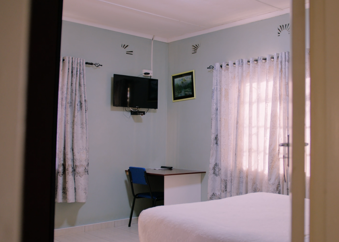 Ensuite room with desk and television at the Downtown branch